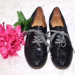 Naya shiny metallic black leather laced loafers